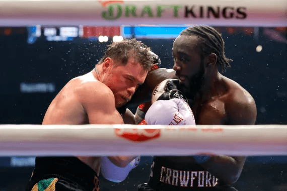Crawford makes history, defeats Canelo